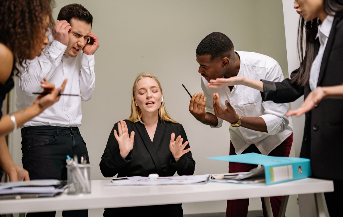 Members of a pseudo team arguing with each other while the team lead is not listening