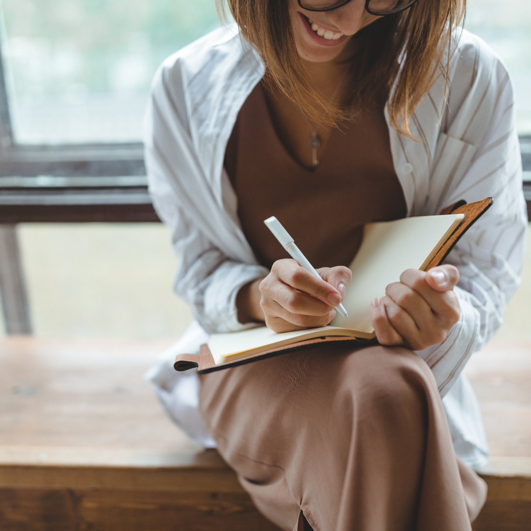 A leader reflecting during a professional development session, reconnecting to purpose and personal clarity