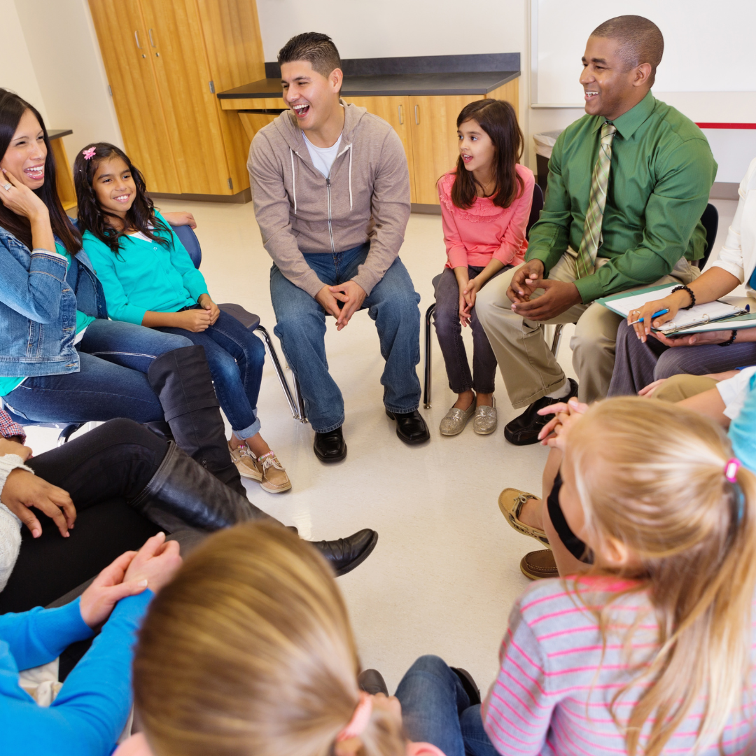 Nonprofit leaders meeting with children and families