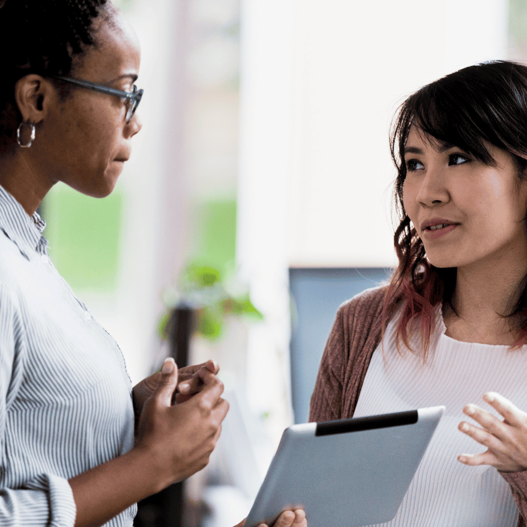 A manager listening to a team member during a conversation about supporting people through change