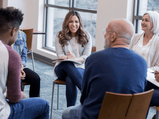 Coach engaging leaders in group coaching