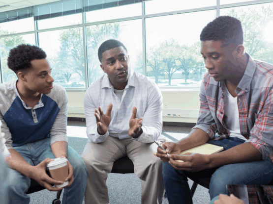 school leaders discussing attendance challenges with high school students