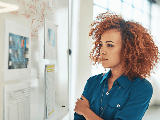 Nonprofit leader pondering what to do to meet community needs