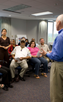 Leader presenting to group of stakeholders